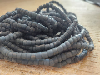 Indonesian Glass "Tube" beads.  approx 4 x 4mm.  24" strand.  Approx 150 Beads/ Strand.  *Matte Deep Blue