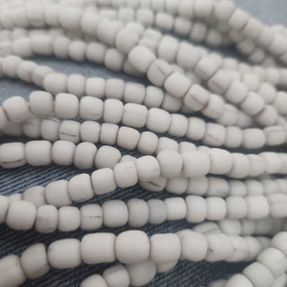 Indonesian Glass "Tube" beads.  approx 4 x 4mm.  24" strand.  Approx 150 Beads/ Strand.  *Dirty White