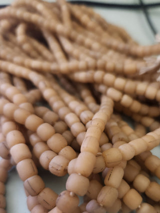 Indonesian Glass "Tube" beads.  approx 4 x 4mm.  24" strand.  Approx 150 Beads/ Strand.  *Warm Sands