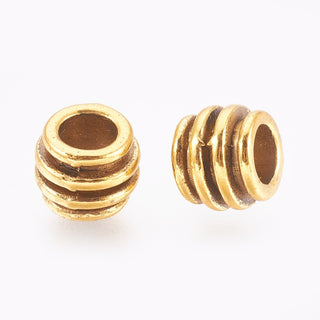 Tibetan Style Metal Alloy Spacer Beads.  Triple Groove.  Antique Gold Color.  8x6mm.  Hole: 4mm.  (Packed 25 Beads)