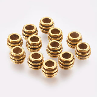 Tibetan Style Metal Alloy Spacer Beads.  Triple Groove.  Antique Gold Color.  8x6mm.  Hole: 4mm.  (Packed 25 Beads)
