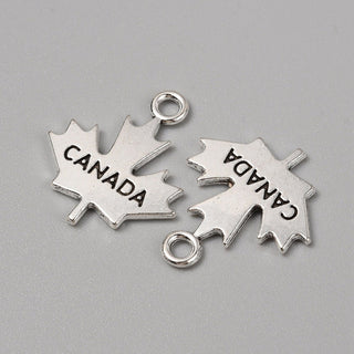 "Canada" , Maple Leaf Charm.  Antique Silver, 22.5x19x2mm, Hole: 2.5mm.  Sold Individually.