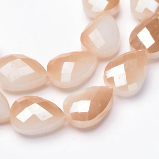 Electroplated Teardrop Shape Beads.  Rainbow Plating over Cream.  18 x 13 x 9mm.  Approx 10 beads per strand.
