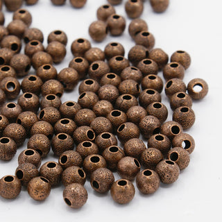 Brass Textured Beads,  Round, Red Copper Color, Size: about 6mm in diameter, hole: 1mm  *approx 100 Beads - .7 oz bag.