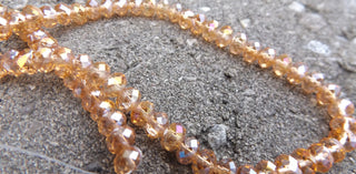 Electroplate Glass Beads, Faceted, Rondelle, (Rich Peach), 6x4.5mm, Hole: 1mm; - Mhai O' Mhai Beads
 - 1