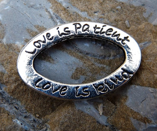 Link (Oval with the words:  Love is Patient, Love is Kind"). Back side says:  Love Never Fails. - Mhai O' Mhai Beads
 - 1