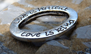 Link (Oval with the words:  Love is Patient, Love is Kind"). Back side says:  Love Never Fails. - Mhai O' Mhai Beads
 - 2