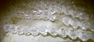 Bicone (Glass)  *Clear  6mm size.  (approx 52 beads per 14" strand).