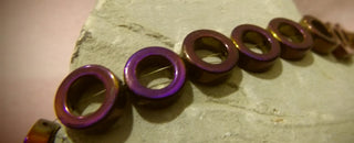 Hematite (Vivid Purple Electroplated Holed Donuts) 12mm diam. (Non Magnetic)  15" Strand
