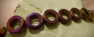 Hematite (Vivid Purple Electroplated Holed Donuts) 12mm diam. (Non Magnetic)  15" Strand