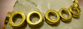 Hematite (Gold Color Plated Holed Donuts) See Drop Down for Size Options. (Non Magnetic)  15" Strand