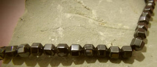 Hematite (Magnetic Faceted Pentagon Shaped Beads) 5 x 5mm Size.   Approx 75 Beads per 16" Strand