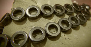 Hematite (Holed Donuts) 12mm diam. (Non Magnetic)  15" Strand