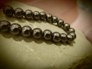 Hematite (dark)   15" Strand. See drop down for size options.  * Magnetic