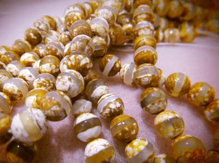 Agate (DZI Faceted Tibetan Style Rounds).  Natural Creams/Tans with Banding.  (See Drop down for Size Options)