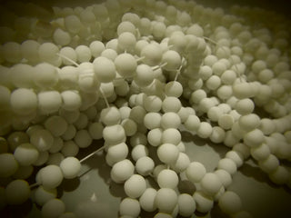 Glass Beads (White Rubber Coated Glass)  6mm Round. 15.5" strand