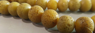 Glass Indonesian / Bali Beads.  8 x 10mm Round.  Organic Yellow  *Priced per 10 Beads.