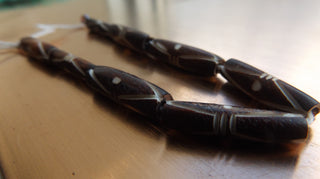 Bone Beads (Bali Indonesia).  *8 Carved Tube Bone Beads Brown .  Approx 23 x 8 mm in size.