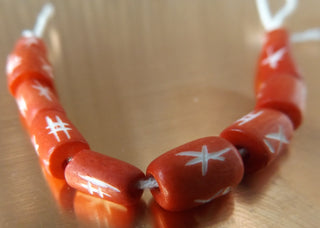 Bone Beads (Bali Indonesia).  *10 Carved Barrel Bone Beads Red .  Approx 9 x 8 mm in size.