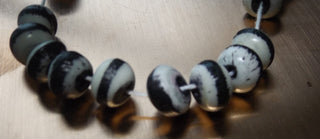 Bone Beads (Bali Indonesia).  *10 Rondelle Bone Beads. White with Black Center Stripe .  Approx 12 x 5 mm in size.