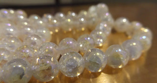 Natural Crackle Quartz Crystal ( 9mm Rounds).  16" Strand (approx 44 Beads)