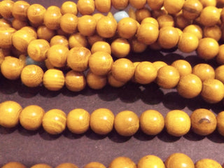 Wood (Sandalwood) *8mm Rounds (approx 100 Beads).  (includes guru bead)