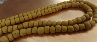 Indonesian Glass "Tube" beads.  approx 4 x 4mm.  24" strand.  Approx 150 Beads/ Strand.  *Mustard