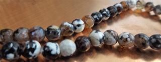Agate (8mm rounds) 15.5" strand.  *Faceted.  approx 47 beads.  Fire Agate Black/Tan/White