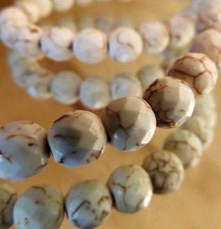 Howlite (8mm Rounds)  *Faceted Off White with Brown Veins  15.5" strand