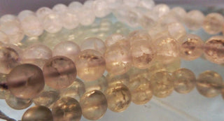 Natural Crackle Quartz Crystal  ( 8mm Rounds).  16" Strand (approx 44 Beads)