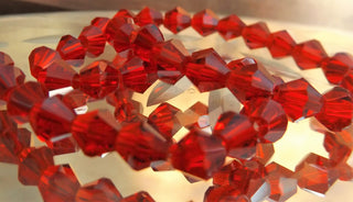 Bicone (Glass)  *Clear Rich Red 6mm size.  (approx 50 beads strand).