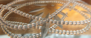 Glass Round (2mm) Clear beads.  Approx 125 beads