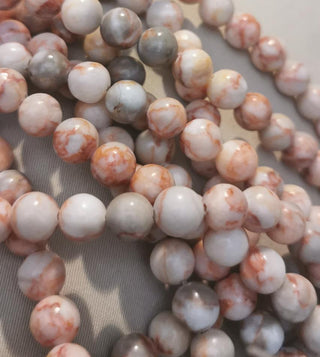 Natural Net Stone (Shades or Coral)* Round  (8mm)  *16" strand.  Approx 50 beads