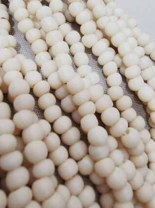 Glass Indonesian / Bali Beads.  *Recycled Glass.  Imperfect Rounds approx 5mm size (Approx 140 Beads)  Organic Pale Tan color.