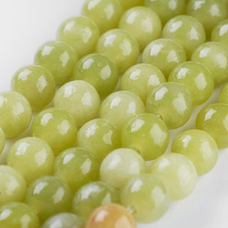 Peridot.  Round.  Soft Greens.   (6 mm Size) approx 60 Beads